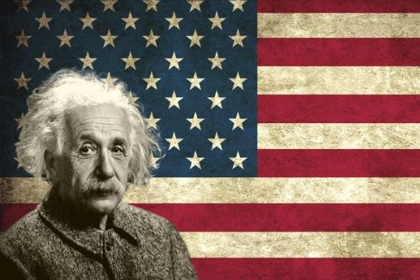 Albert Einstein in front of US flag
