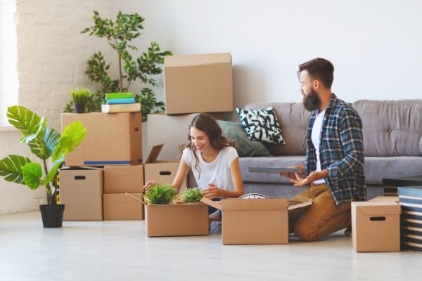 Couple in the middle of boxes 